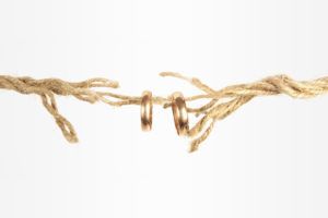 Divorce concept - rings on broken rope
